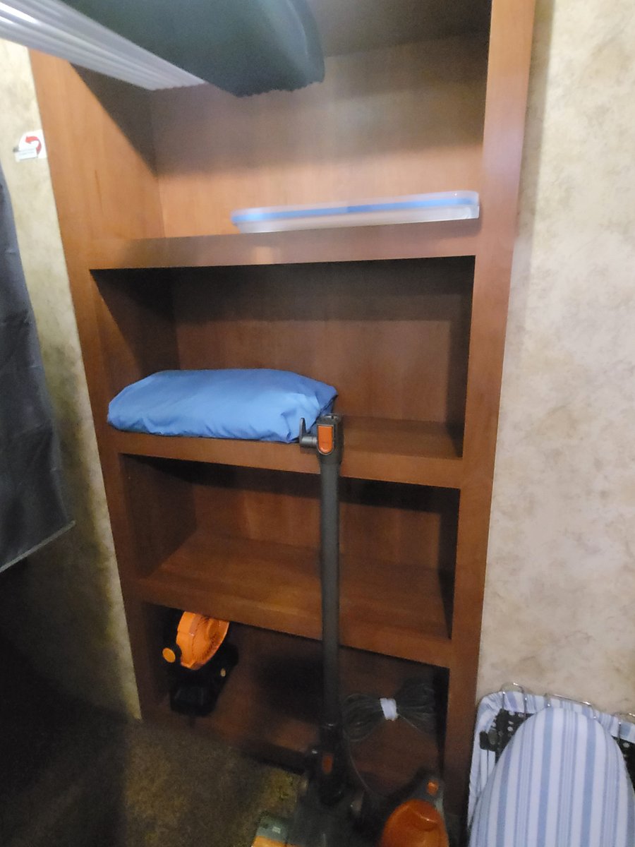 Shelves in the back of the closet. Extra set of sheets.