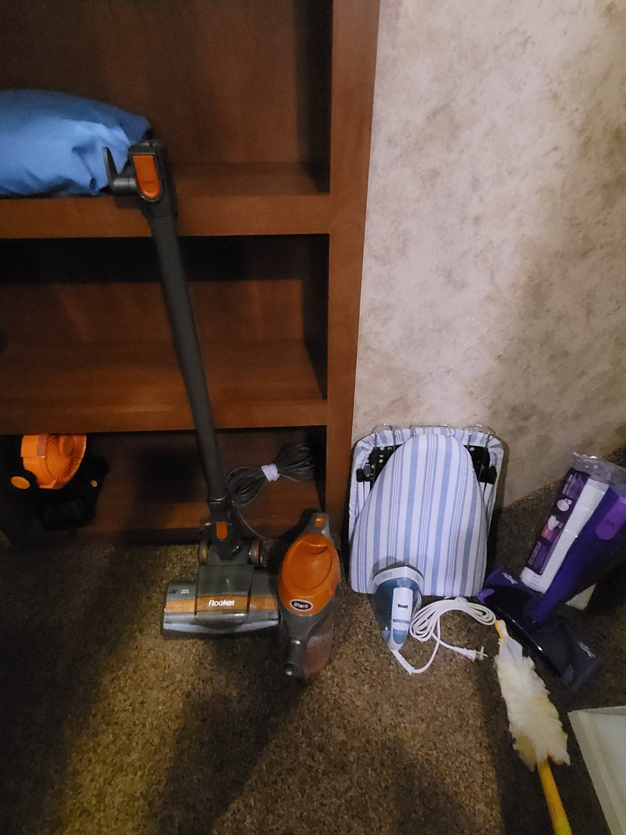 Stick vacuum. Fold out ironing board. Steam iron. Swiffer mop. Broom and dust pan. Swiffer duster.
