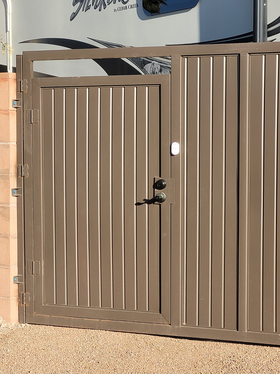 "Door" entry within the gate. Handle lock and deadbolt lock. Doorbell and motion sensor light. Tenant will have the keys.