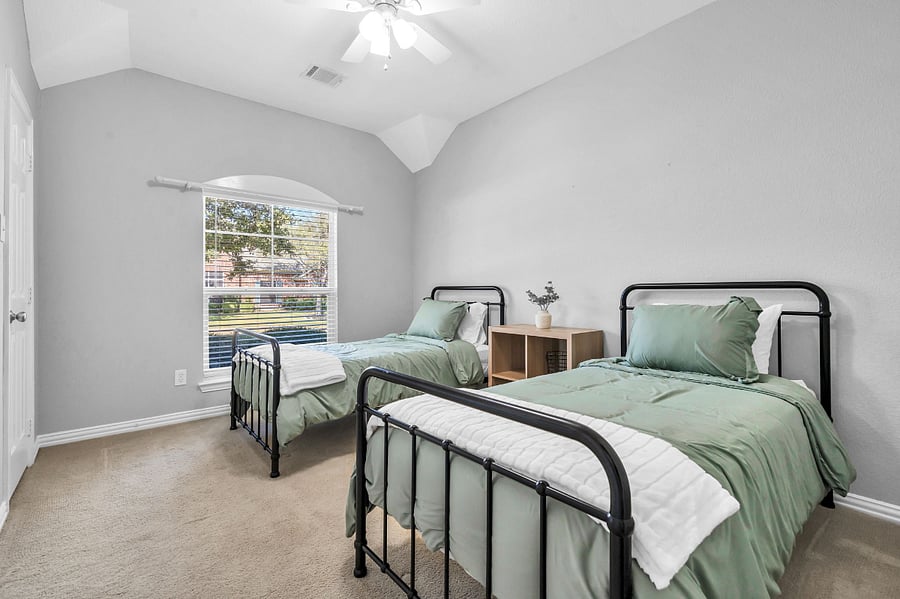 Twin Room
Tranquil bedroom showcasing two twin beds and a spacious, bright window.