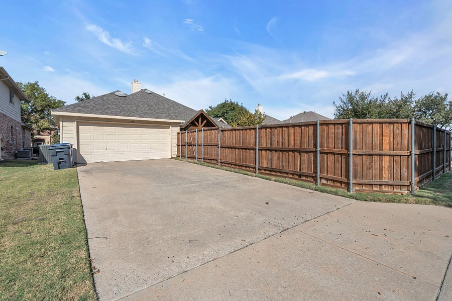 Rear entry garage and driveway parking.