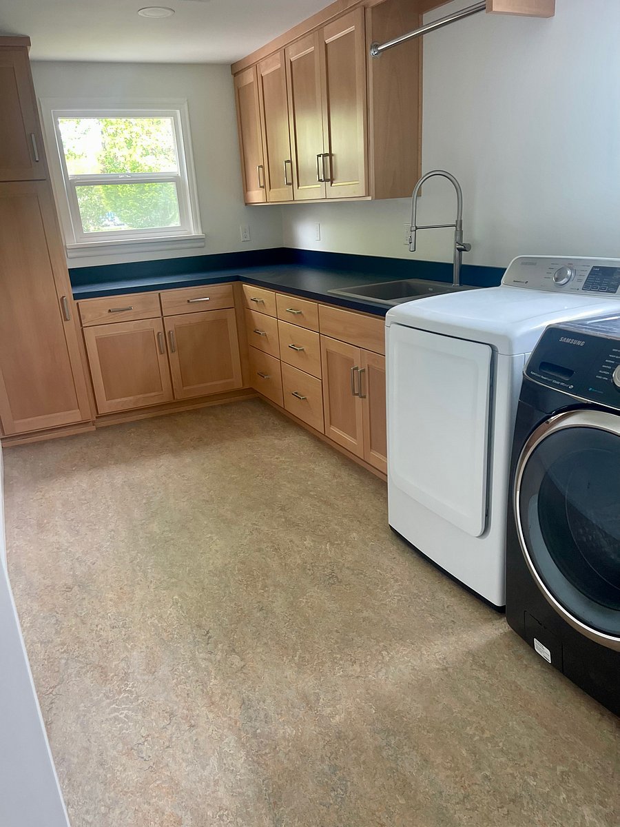 New utility room with sink, washer and dryer.