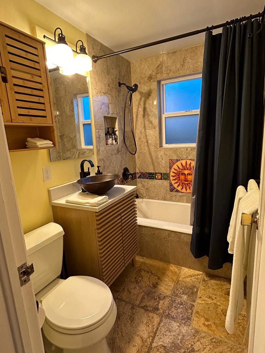 Newly renovated bathroom with bathtub and shower