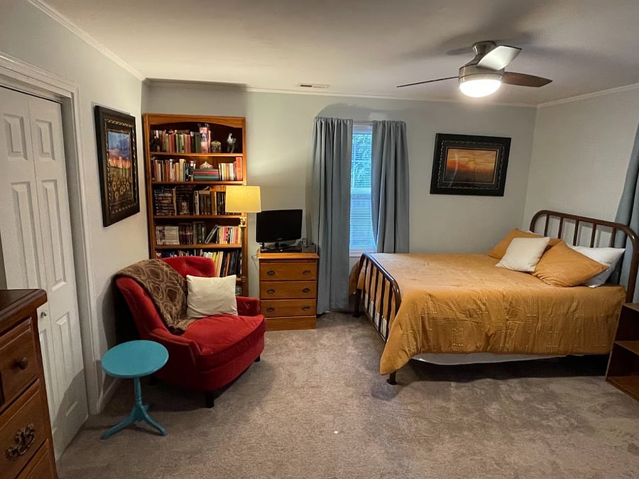 Your room - full-sized bed, desk, two dressers, tv with streaming, armchair, and bookcase.