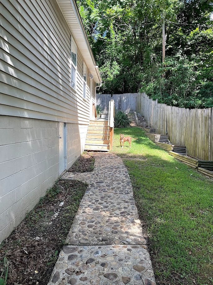 Quiet backyard with raised garden beds.
(I keep trying to grow things!)