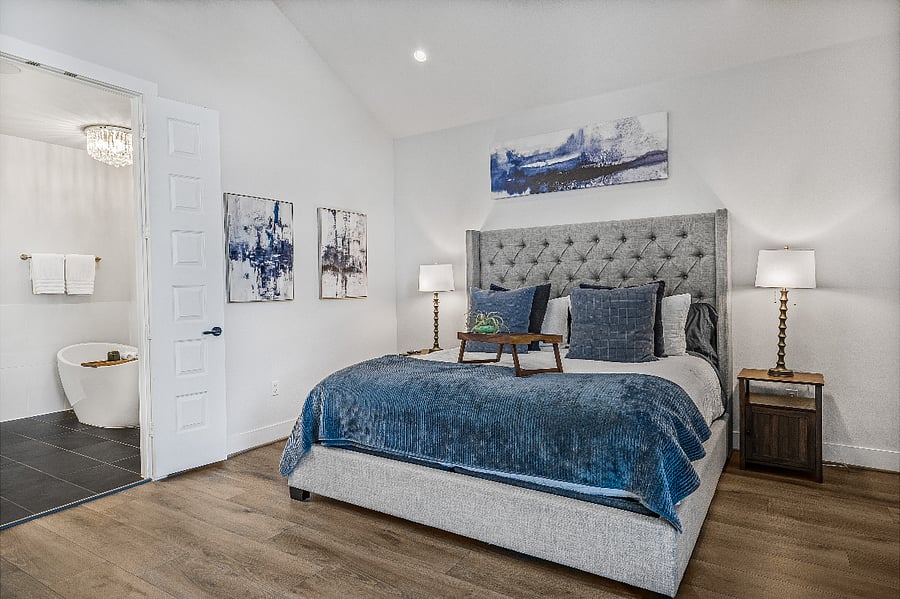 Bedroom #1: Large primary bedroom with king-size bed and 55" smart TV and on-suite bathroom.