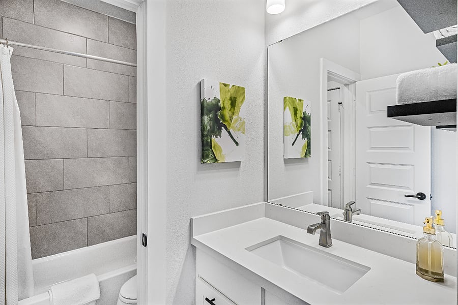 Bathroom #3: Upstairs private bathroom vanity in Bedroom #4 that leads to a shared shower/toilet.