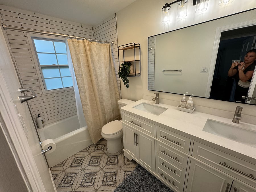 Hallway bathroom with a tub