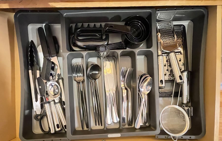 Well stocked kitchen with cookware and dishes