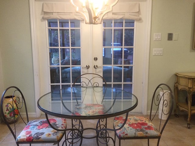 Dining table, french doors leading to sun room