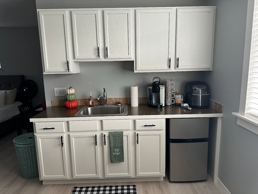 Keurig, ice maker, microwave, mini fridge, hot plate, and cooking/eating utensils provided