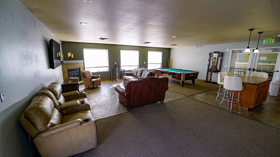 Resort Amenities with Pool Table, sitting area with TV, and kitchen with full size fridge.