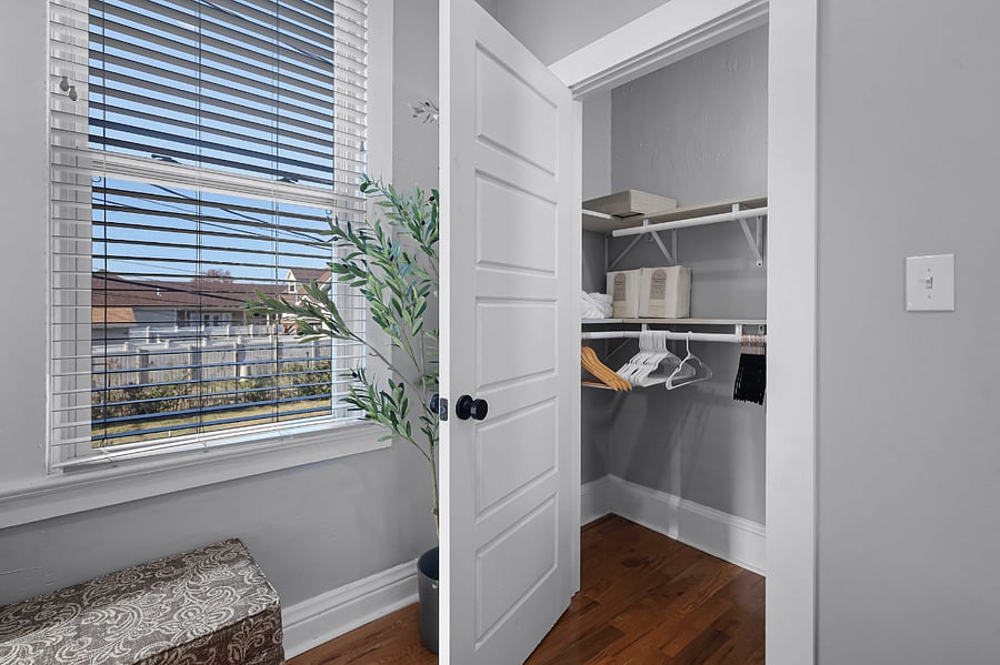 View Inside Closet with Double Shelves and Side Storage