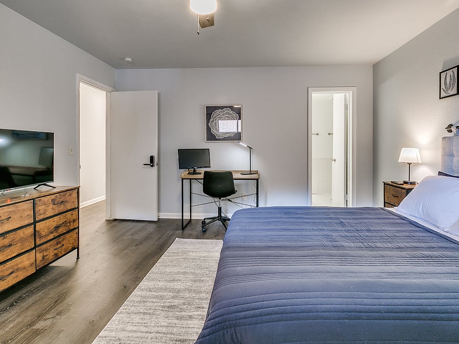 Master Bedroom with ensuite bathroom, walk-in closet, and office desk/chair.