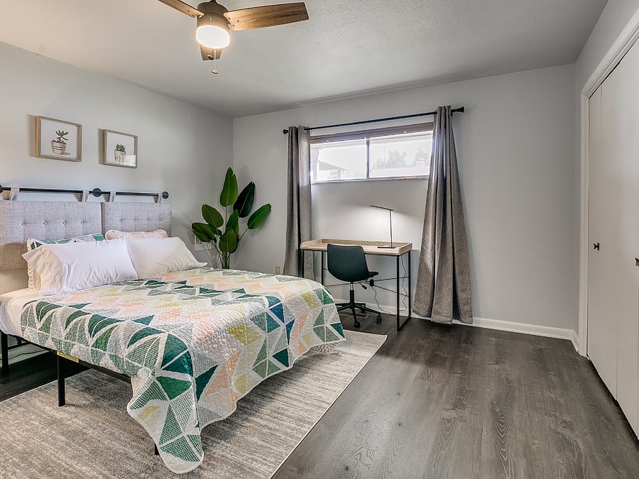 Bedroom #2 with private hallway bathroom, double closet, and office desk/chair.