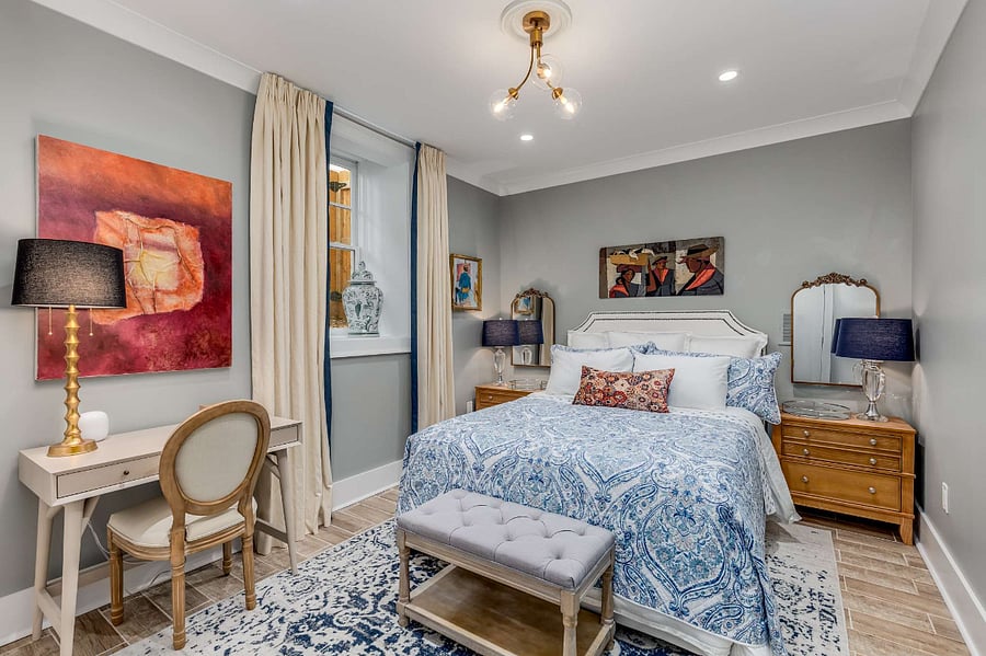 Large bedroom with queen-sized bed, work desk & chair, and large closet with hangers for clothes and space for storage. Night stands have three drawers for storage well. Extra pillows and blankets provided.