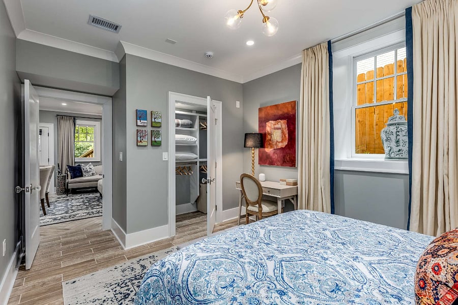 Large bedroom with queen-sized bed, work desk & chair, and large closet with hangers for clothes and space for storage. Night stands have three drawers for storage well. Extra pillows and blankets provided.