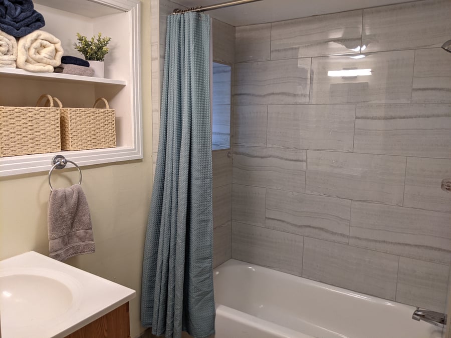Freshly renovated, bright, and clean bath with all the hot water youre dreaming of.