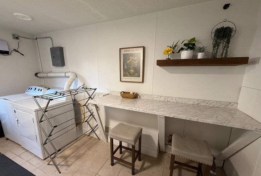 Shared laundry room with free use machines.