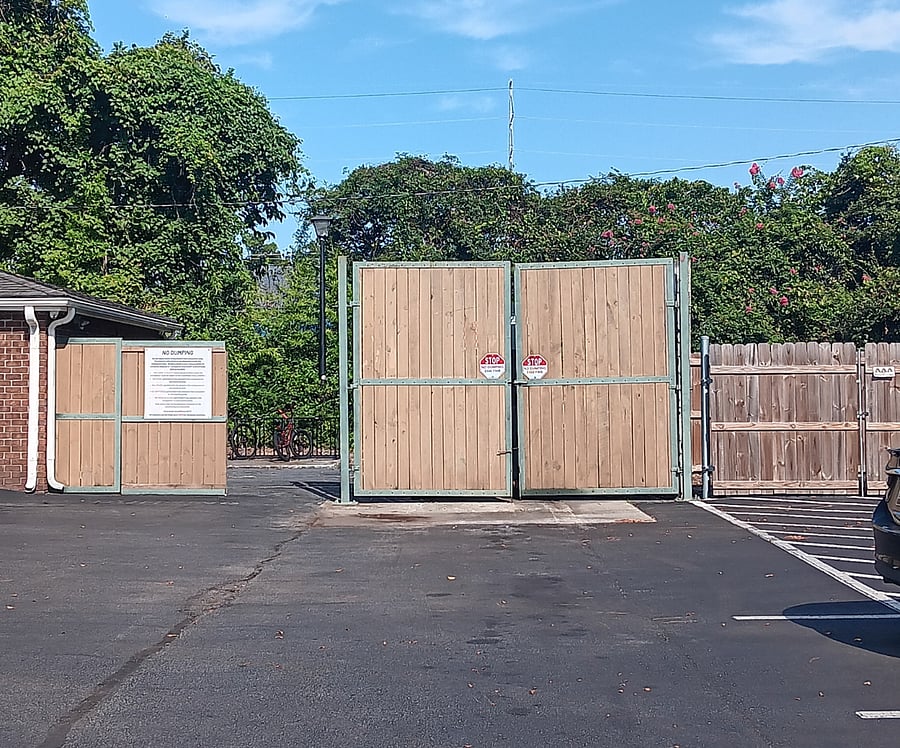Dumpster area at end of parking lot