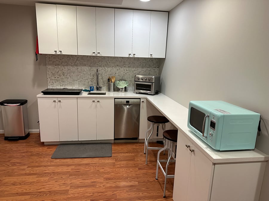 Kitchenette with toaster oven, microwave, dishwasher, cooktop (3 burners available) and fridge.