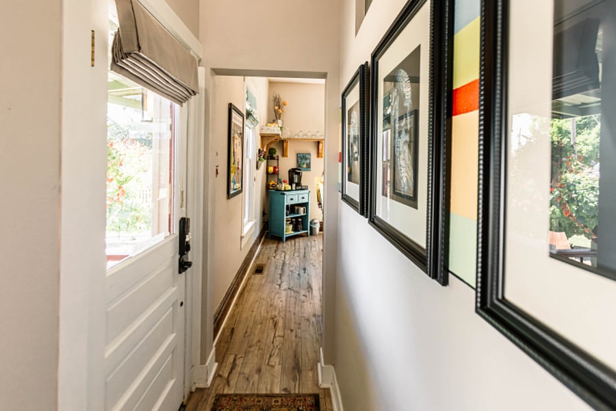 The back entry hallway. A left turn leads to the kitchen & main floor living room, bath & 2 bedrooms. Hang a right to the full laundry room and upstairs two bedrooms and full bath.