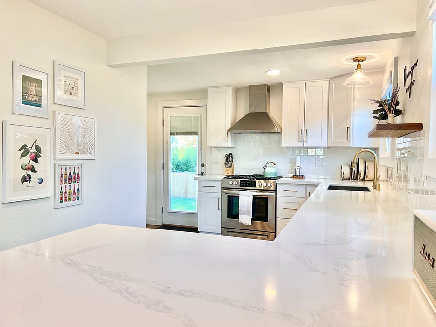 Fully-stocked kitchen with quartz counters and soft-closing cabinets