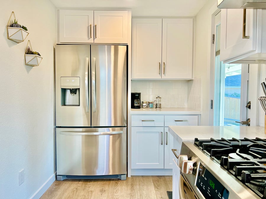 Fully-stocked kitchen with quartz counters and soft-closing cabinets
