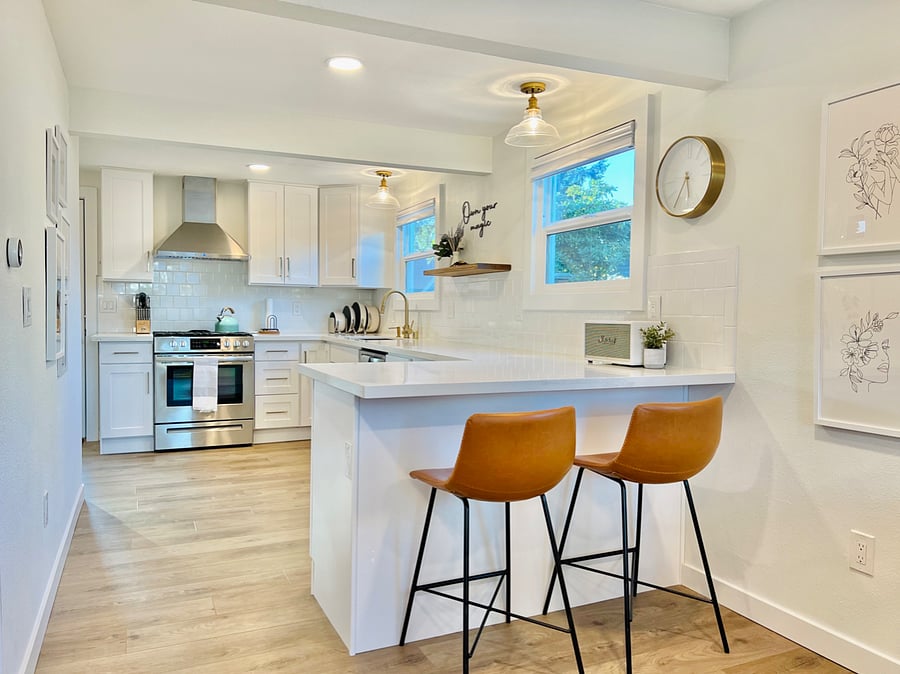 Fully-stocked kitchen with quartz counters and soft-closing cabinets