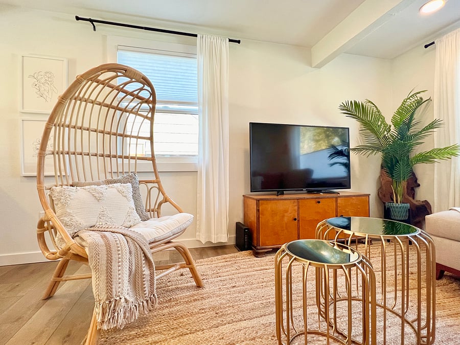 Living room with comfy L-shaped couch with chaise, smart Firestick TV, and high-speed internet