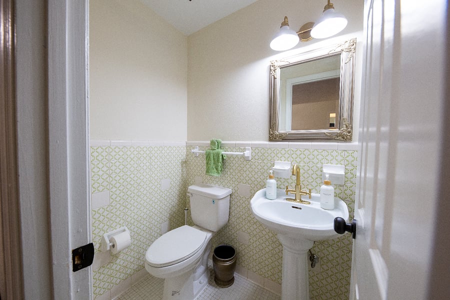 Convenience awaits in our half bathroom! Perfect for quick refreshes, featuring essential amenities for your comfort during your stay.