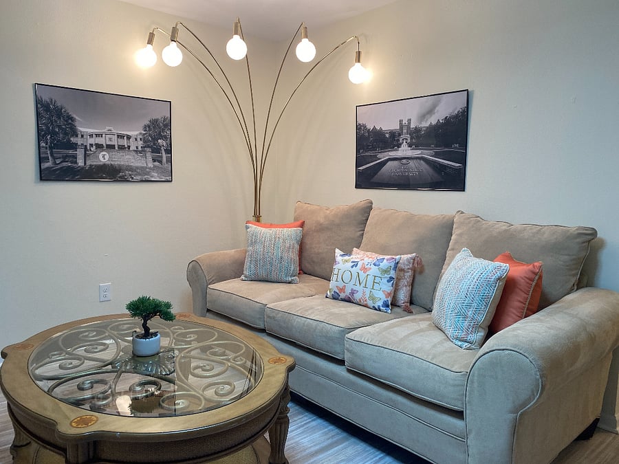 A spacious living room featuring a grand bay window.