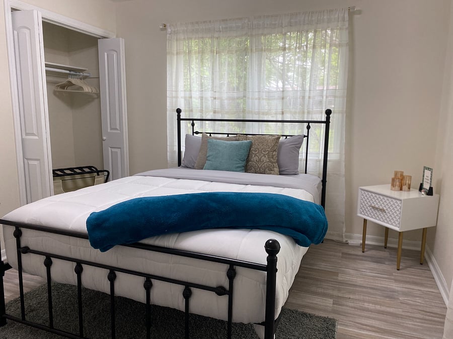 Welcome to your cozy retreat! Our third guest bedroom is thoughtfully appointed with all the essentials: a dresser, nightstand, closet, luggage rack, desk, 50"TV and mirrorensuring a comfortable stay for our cherished guests.