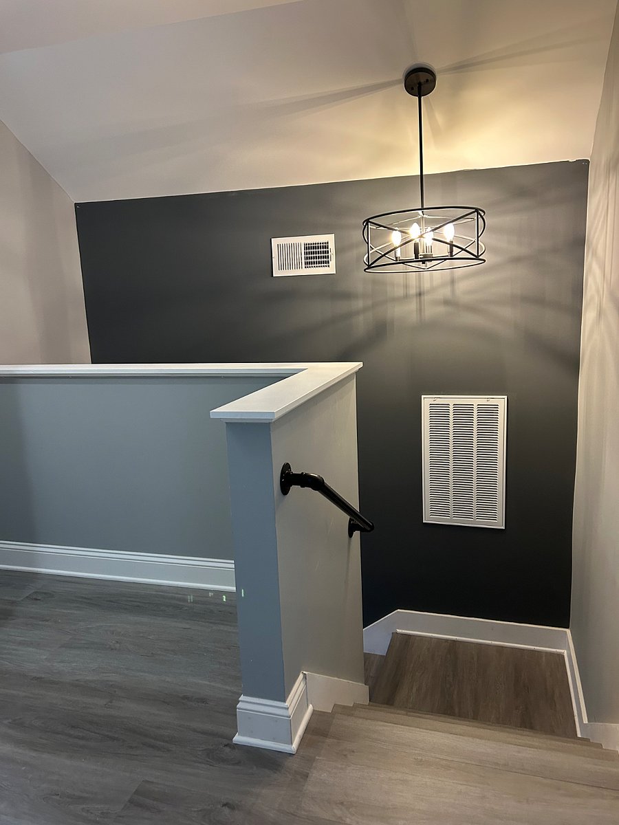 showing top of staircase leading to upstairs bedrooms and sitting area