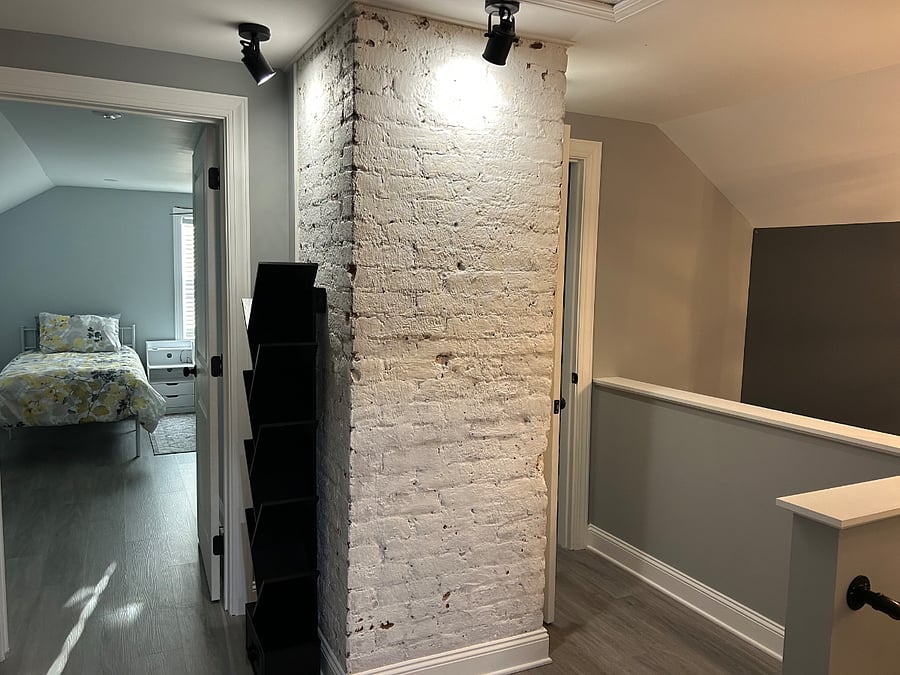Reading area showing exposed brick and spotlights