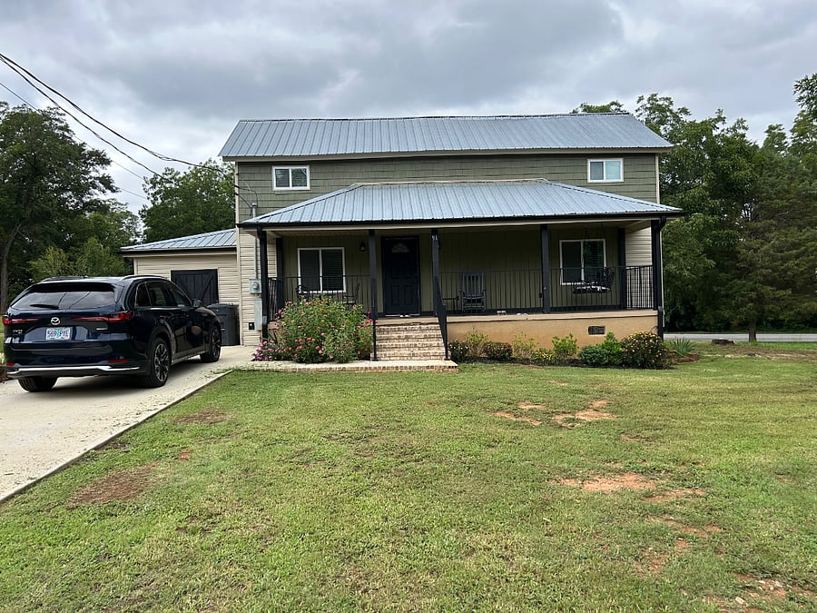 Nice siding and large front porch for enjoying weather