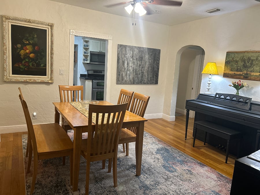 Dining room with piano for entertainment.