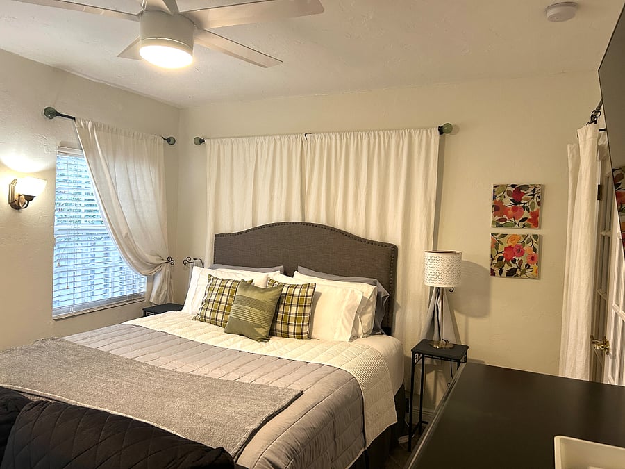2nd primary bedroom with king bed. Room has access to the bathroom and includes large walk- in closet with remote work area. Smart tv 45 inch.