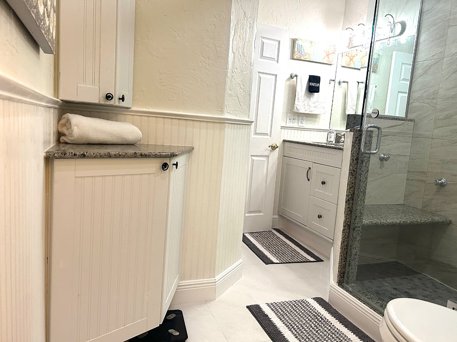 2nd full bathroom with large walk in shower with glass enclosure.