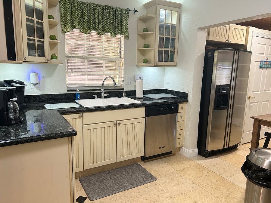 Full kitchen with coffee maker and Keurig machine.