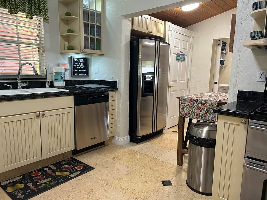Kitchen with pantry, adjacent to the laundry room.