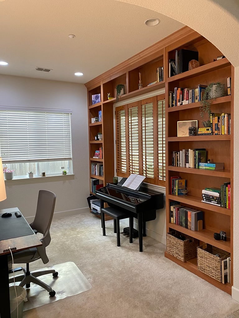 Bedroom that is used as an office and music space.