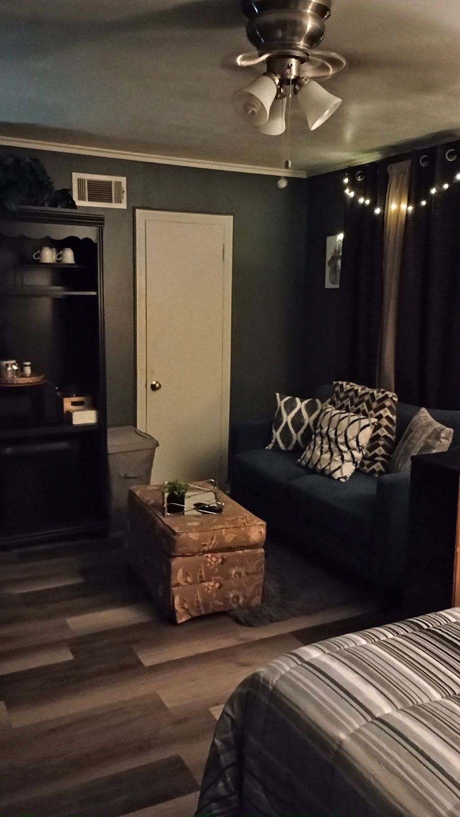 Walk-in Closet entrance equipped with hamper and ironing board!
