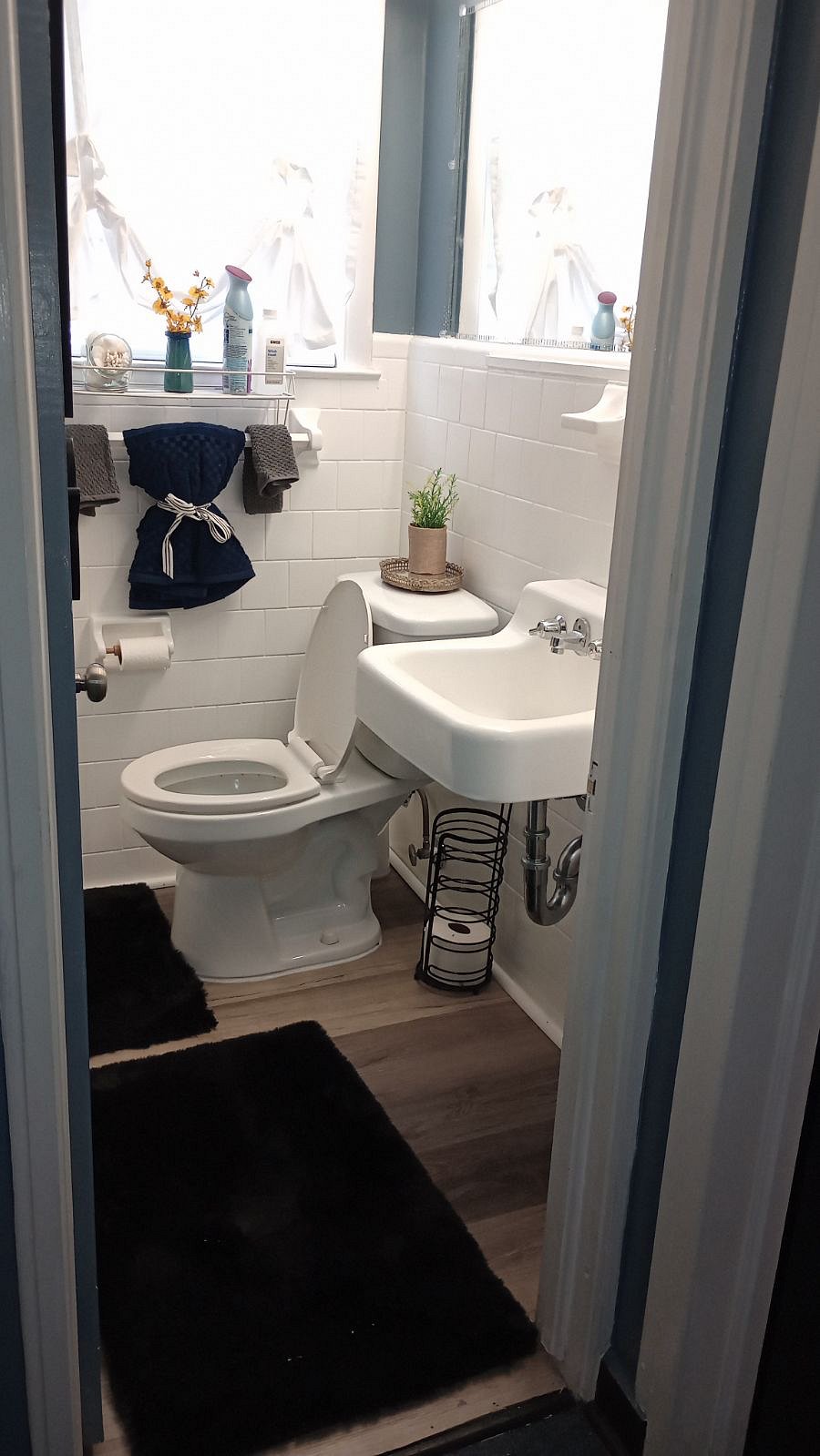 Bathroom complete with tub and shower located upstairs between the two bedrooms.
