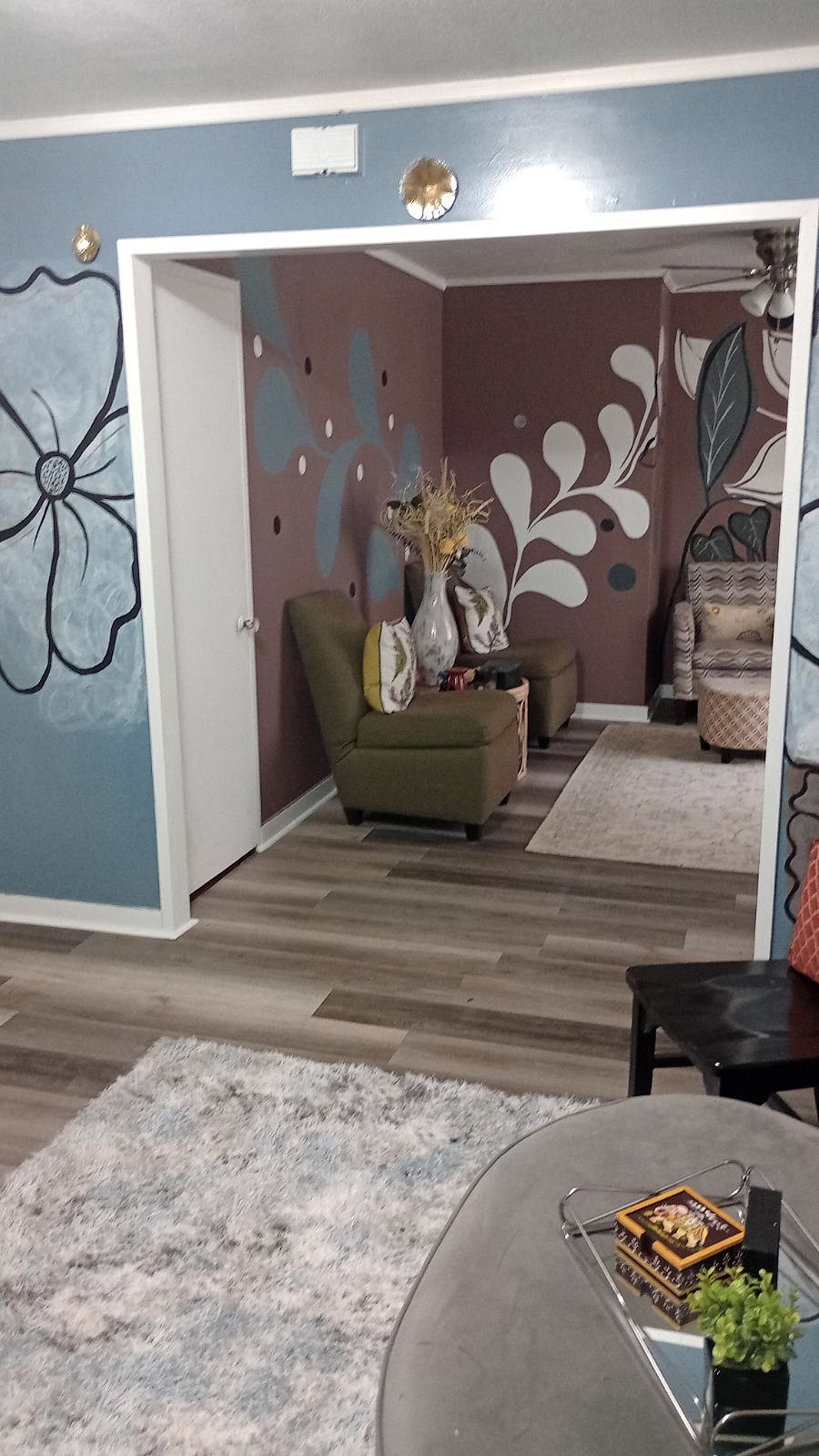 Communal living room area equipped with small television and radio system.