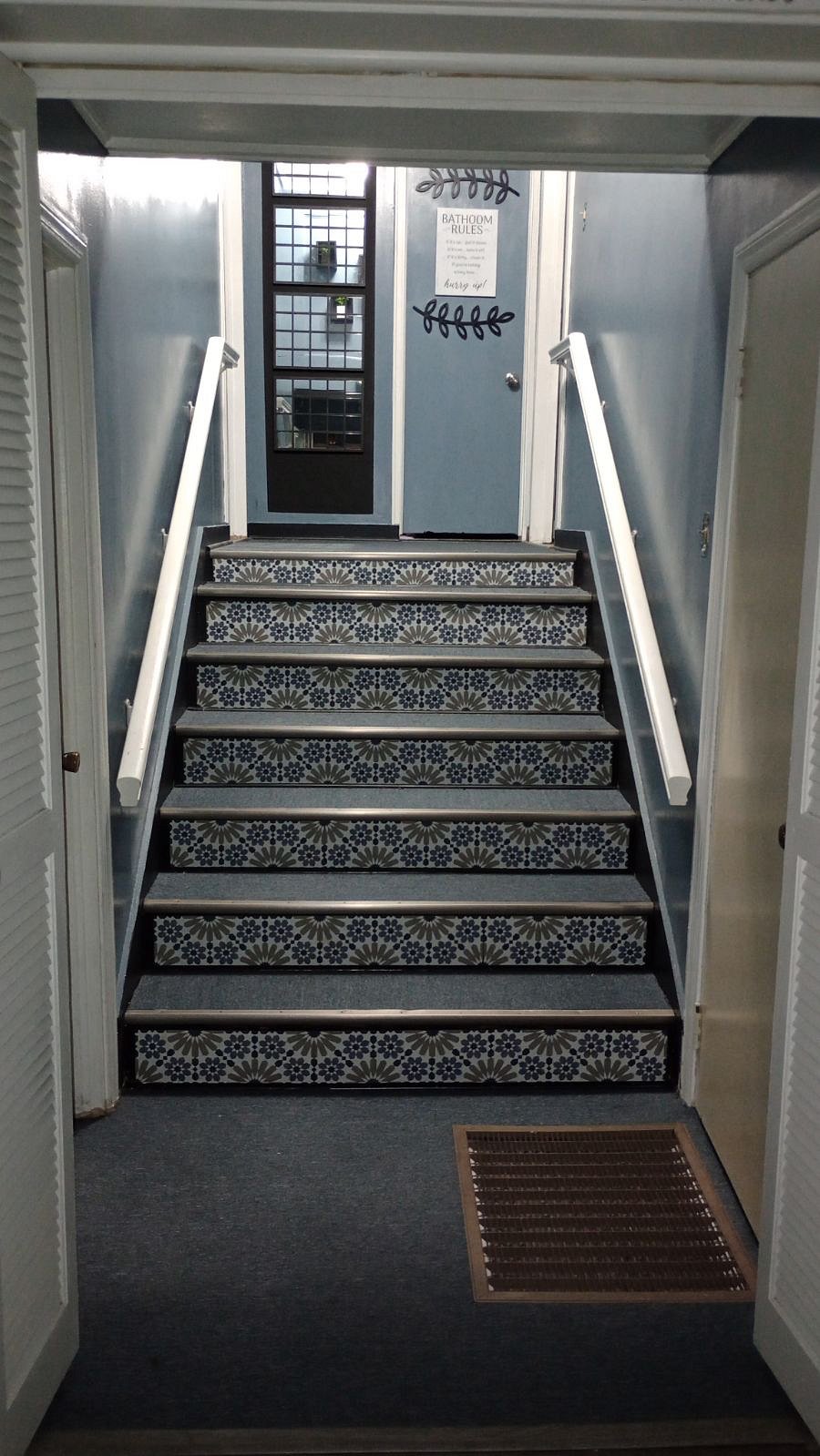 Staircase to upstairs where rooms are located on both sides and bathroom in the middle.  At the base of the stairs to the right, there is a stacker washer/dryer for your convenience.