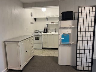 Kitchen - brand new stove/oven and sink/cabinet.