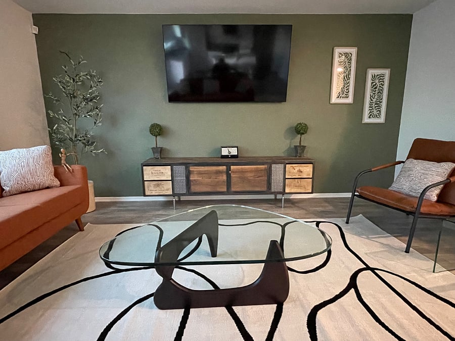 "L" shape couches.
TV on full swivel bracket