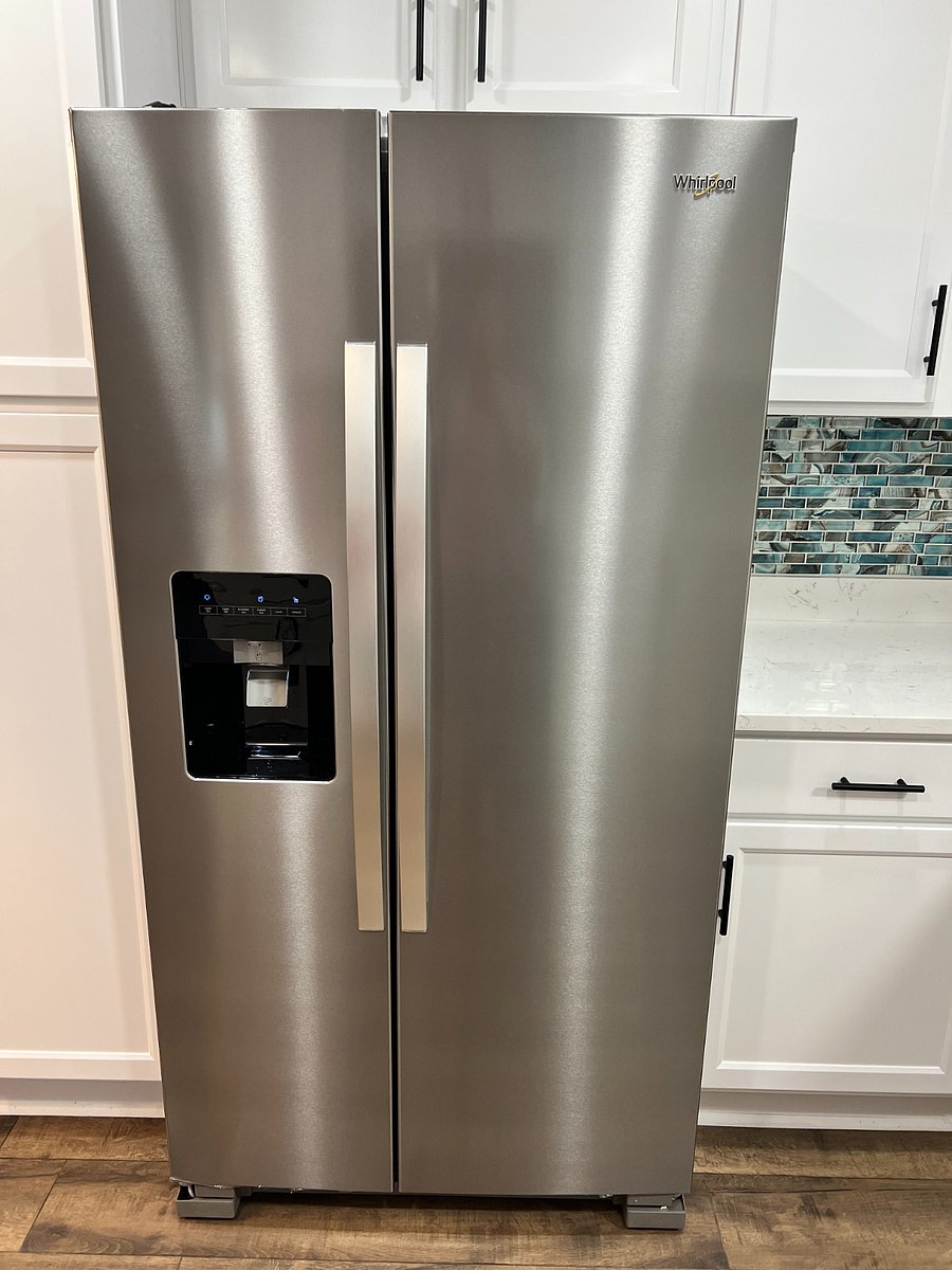Brand new Whirlpool Double French Door Refrigerator with ice maker and water dispenser
