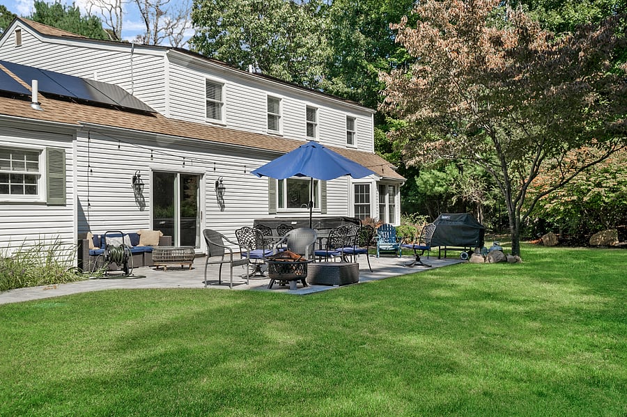Patio with outdoor furniture, hot tub, and grill